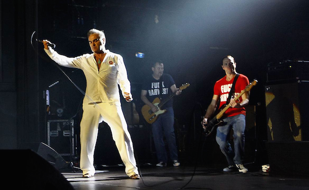 Morrissey Returns To The Stage With Band In "Fuck Harvest" T-Shirts