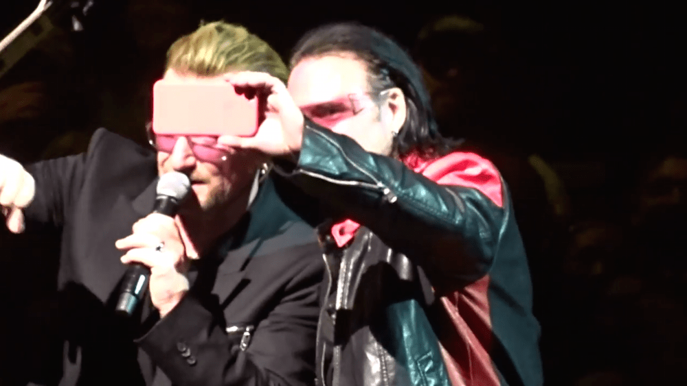 Bono Impersonator Gets To Sing Onstage With U2 And Won't Put His iPhone Down