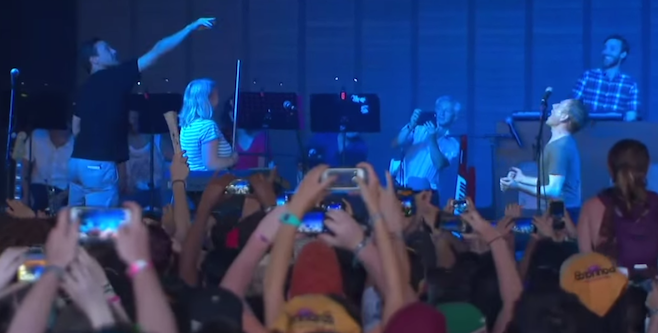 Watch Jon Hamm Feed Belle And Sebastian Gummy Bears Onstage At Bonnaroo