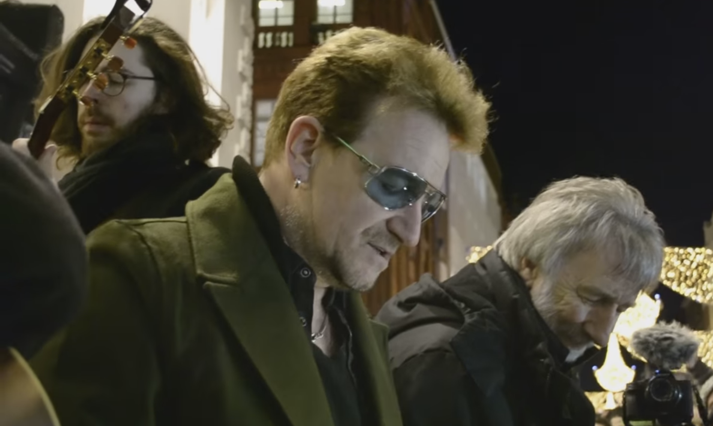Watch Bono's Annual Charity Busking On Christmas Eve
